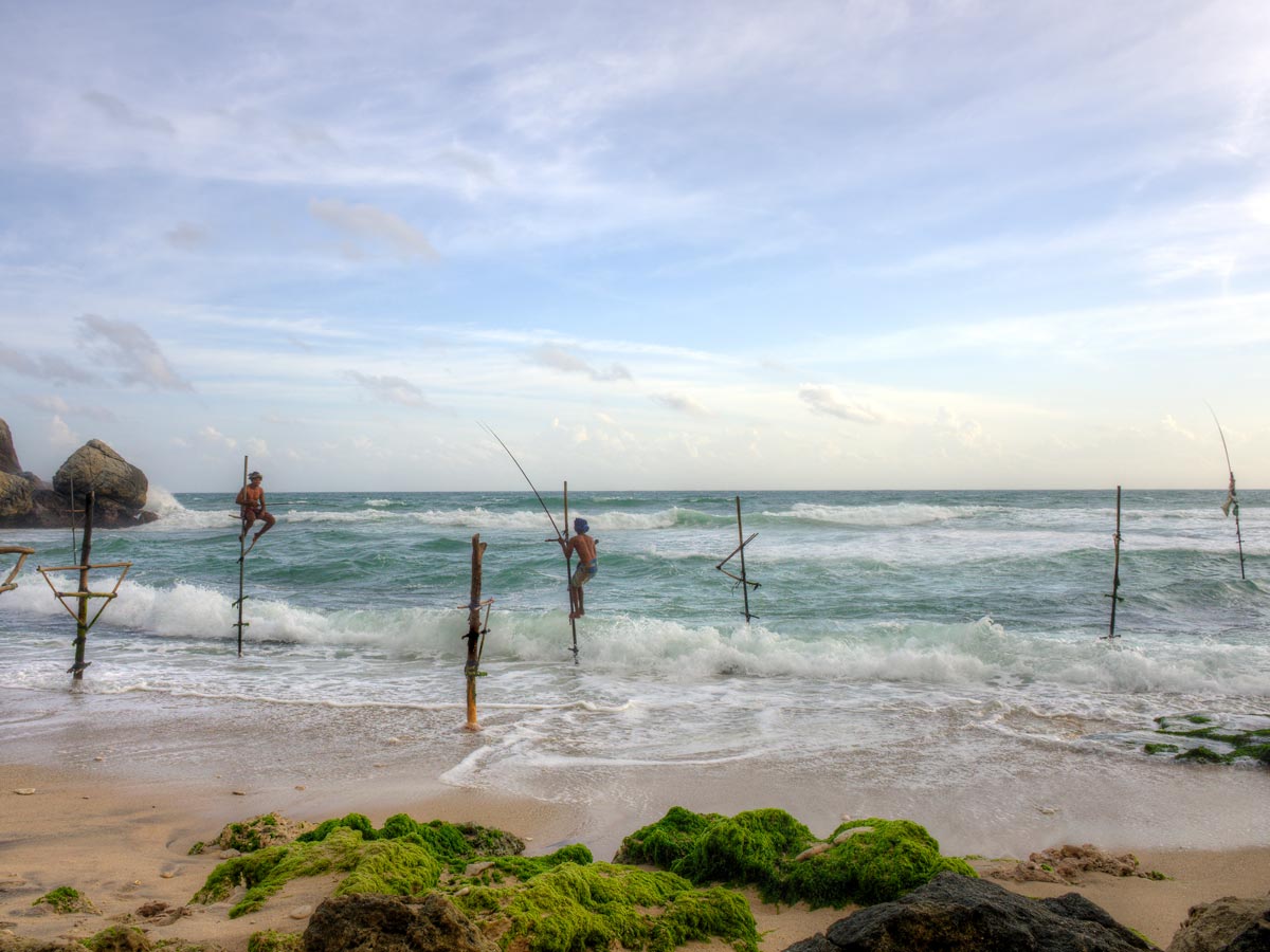 Stilt fisherman outside Galle